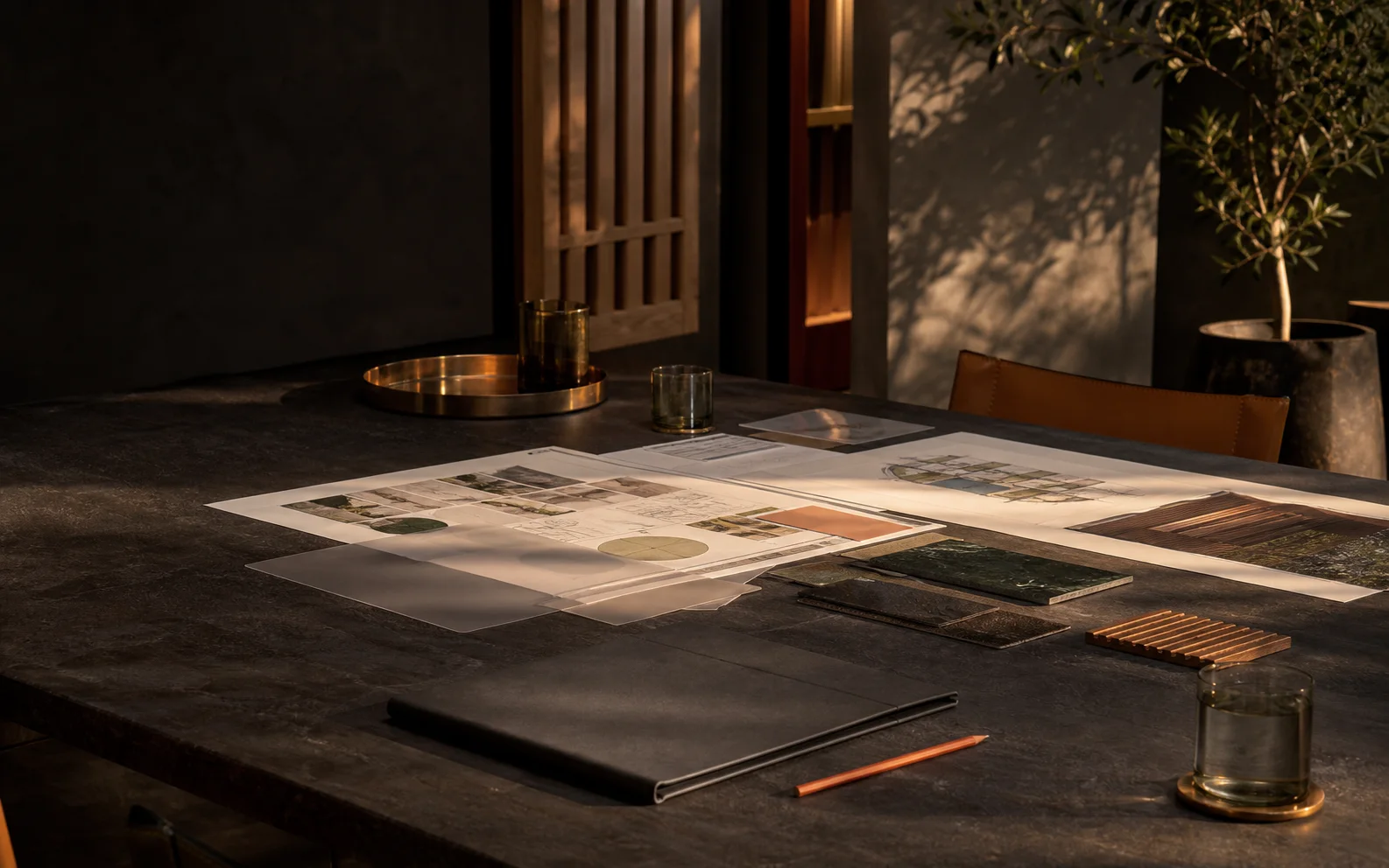A finished presentation, operating diagrams, and working materials arranged on a conference table after a strategy session